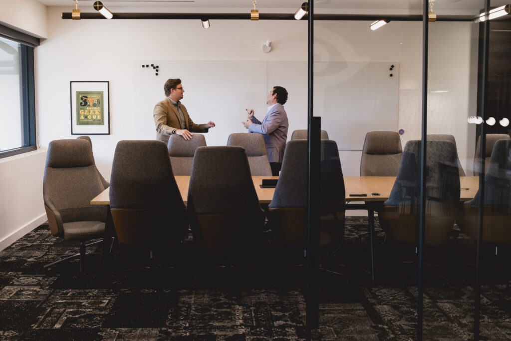 Bryce Chapman and Evan Winegard in a Fido conference room